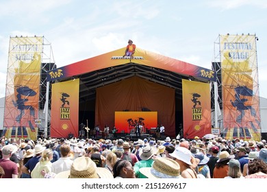 New Orleans, LA  United States - April 30, 2022: Crowds at the 2022 New Orleans Jazz and Heritage Festival on the "Festival Stage" dance to funk legend Big Sam's Funky Nation. 