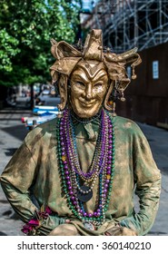 New Orleans, LA USA - 06/01/2015 - New Orleans French Quarter Street Performer In Mardi Gras Mask

