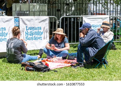 NEW ORLEANS, LA, USA - APRIL 14, 2019: People Eating Crawfish At French Quarter Festival In New Orleans