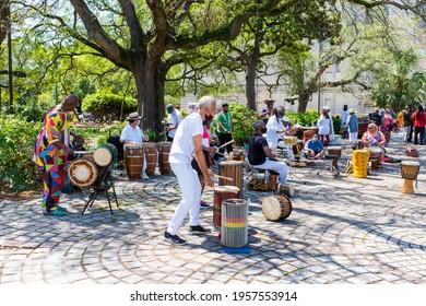 NEW ORLEANS, LA, USA - APRIL 11, 2021: Percussionists, with Luther Gray in foreground, perform in Congo Square to celebrate the life of Alfred "Uganda" Roberts