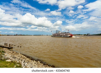 New Orleans, LA USA - April 20, 2016: The Mississippi River With Departing Paddle Boat Viewed From The French Quarter.