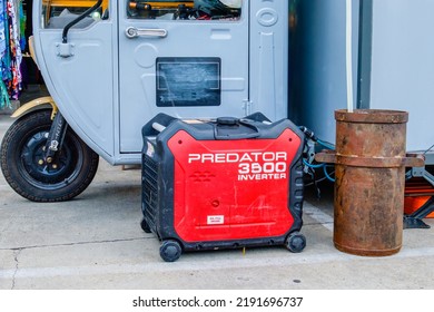 NEW ORLEANS, LA, USA - AUGUST 14, 2022: Predator 3500 Inverter Generator Supplying Energy To A Small Business Operation In The Back Of A Miniature Truck