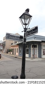 New Orleans, LA, USA
August 19, 2022
Street Signs On A Light Post That Says Bourbon And Ursuline Street. 