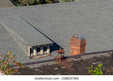 NEW ORLEANS, LA, USA - JANUARY 13, 2022: Aerial View Of Rooftop Of Historic Home In The Garden District Showing Vintage Chimneys And Dormer Attic Window