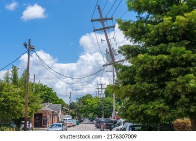 NEW ORLEANS, LA, USA - JULY 2, 2022: Severely Leaning Utility Pole In Uptown New Orleans Neighborhood