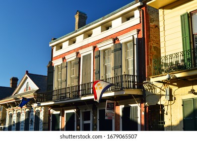New Orleans, LA, USA June 9, 2017 A fleur de lis flag flies from a balcony in the New Orleans French Quarter