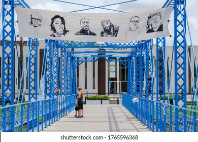 NEW ORLEANS, LA, USA - JUNE 27, 2020: Magnolia Bridge Over Bayou St. John With Banner Showing Images Of Victims Of Racial Injustice