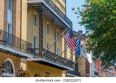 New Orleans, LA, USA - June 22, 2022 - American Flag On Colonial Buildings In The French Quarter