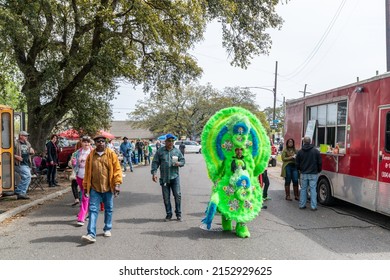 NEW ORLEANS, LA, USA - MARCH 17, 2019: People, Including A Mardi Gras Indian, Walking Past A Food Truck On LaSalle Street Before The Start Of The Parade On Super Sunday