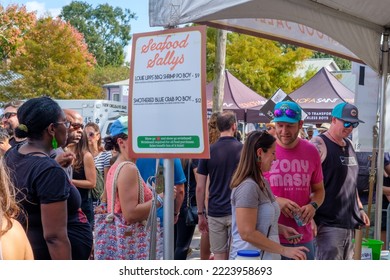 NEW ORLEANS, LA, USA - NOVEMBER 6, 2022: Crowd Surrounding The Seafood Sally's Restaurant Food Booth At The Free Oak Street Po-Boy Festival