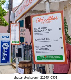 NEW ORLEANS, LA, USA - NOVEMBER 6, 2022: Selective Focus Of The Old Alker Distillery Sign On The Company's Food Booth At The Free Oak Street Po-Boy Festival