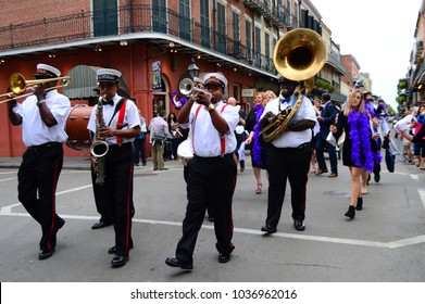 New Orleans, LA, USA October 27 A Group Of Jazz Musicians Form A Second Line Parade As They Lead A Party Group  Marching Through Down Bourbon Street In The French Quarter Of New Orleans, Louisiana