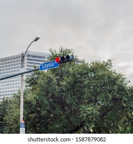 NEW ORLEANS, L.A. / USA - OCTOBER 16, 2019: Loyola Ave Sign On A Light Post With A Skyscraper In The Background, Located In NOLA.