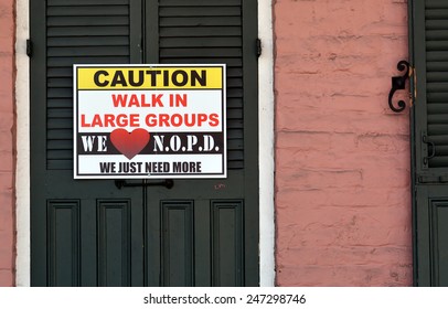 NEW ORLEANS, LA.-JANUARY 24:  A Caution Sign In The French Quarter Warning Tourists In Town For Mardi Gras To Walk In Large Groups, In New Orleans On January 24, 2015, Due To A  Recent Crime Spree.