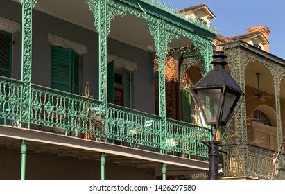 New Orleans, Louisiana- December 29, 2017: New Orleans Wrought Iron Balcony And Street Lamp