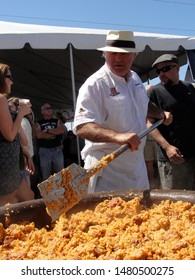 New Orleans, Louisiana - May 15 2011: A Chef Prepares A Large Pot Of Jambalaya 