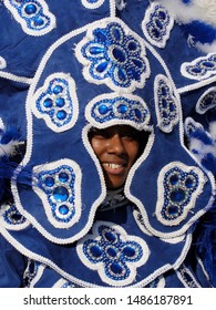 New Orleans, Louisiana - May 8, 2011: A Smiling Mardi Gras Indian In Blue Head Gear At Jazz Fest