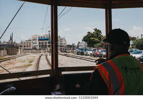 New Orleans,\
Louisiana / United States - June 26-2018: Streetcar driver in\
downtown New Orleans on Canal\
Street.