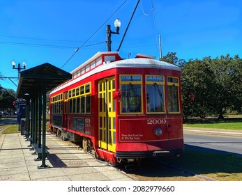 New Orleans, Louisiana, US- November 24, 2021: Bright Red Electric Streetcar Of The Canal Street Line, At The City Park Station.  Popular, Convenient And Cheap Transportations To Tour New Orleans