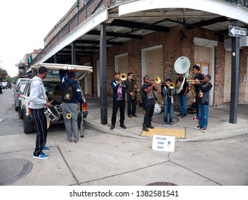 New Orleans, Louisiana, USA - 2019: A Jazz Band Conformed Of Young Men Performs At A Street Corner In The French Quarter To Collect Money For College.