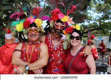NEW ORLEANS, LOUISIANA, USA – AUGUST 7: Participants of the Red Dress Run at a party in Louis Armstrong Park after running down Bourbon Street in the French Quarter of New Orleans on August 7, 2015.