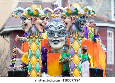 New Orleans, Louisiana, USA - February 23, 2019: Mardi Gras Parade, Float With Jester Heads, Going Down The Street At The Parade