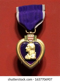 New Orleans, Louisiana, U.S.A. - February 5, 2020 - The Purple Heart Military Decoration Medal On A Red Isolated Background