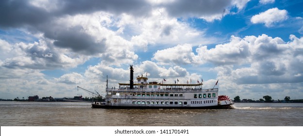 New Orleans, Louisiana, USA -- May 27, 2019.  Wide Angle Shot Of The Paddle Wheel Tourist Boat Creole Queen On The Mississippi River.