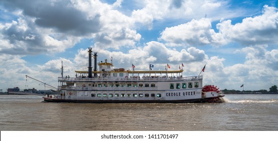 New Orleans, Louisiana, USA -- May 27, 2019.  The Paddle Wheel Tourist Boat Creole Queen On The Mississippi River.