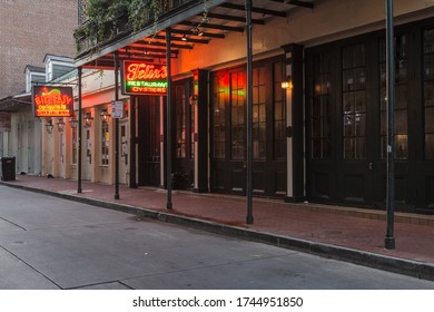 New Orleans, Louisiana. USA - May 25, 2020: Neon Signs For Empty Bars On Bourbon Street Due To Virus