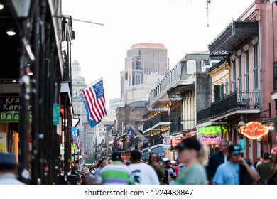 New Orleans, USA - April 22, 2018: Downtown Old Town Bourbon Street In Louisiana Famous Town, City, Night Evening Sunset, Cityscape Skyline