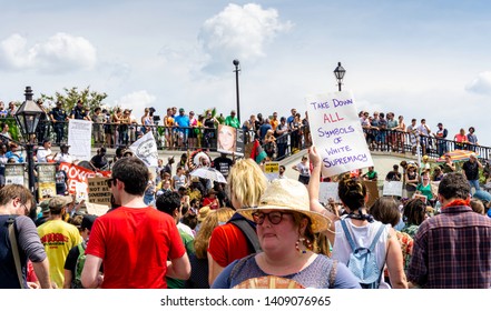 New Orleans, USA - Aug 20, 2017: Protesters gather with banners and signs at Jackson Square in the French Quarter. They were protesting against Trump, the KKK, Fascism and other social issues.