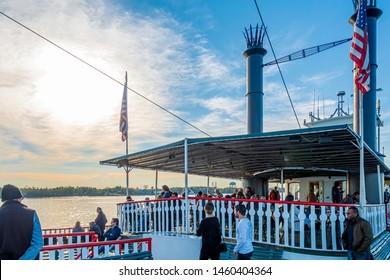 New Orleans, USA - Dec 11, 2017: Onboard The Steamboat Natchez. Passengers Enjoy The Mississippi River Cruise And The Setting Sun.