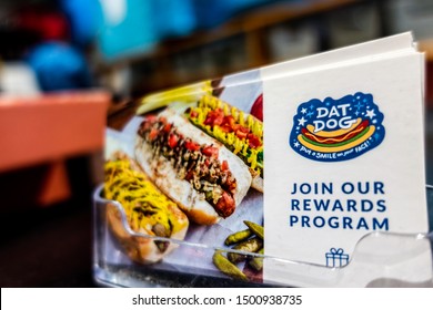 New Orleans, USA - Dec 11, 2017: Cards On A Rack Sitting On A Counter At The Dat Dog Hot Dog Restaurant Along Frenchmen Street, Urging Customers To Join Their Rewards Program By Submitting A Card.