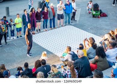 New Orleans, USA - Dec 4, 2017: A Street Performer Doing His Act Entertaining A Public Audience Along Decatur Street, French Quarter.