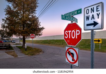 New Orleans, USA - Nov 28, 2017: Intersection Between Plaquemine St. And Orpheum Av. In Bucktown. Features Street Signs And Flood Canal Levee (17th Street Canal).