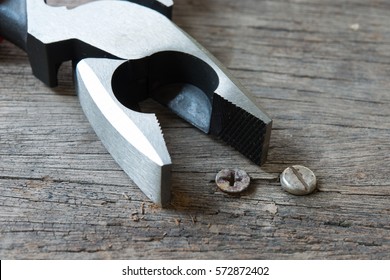 New Pair Of Lineman Pliers On Wooden Board