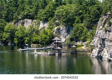 New Paltz, New York - July 11, 2015:  Hotel guests of Mohonk Mountain House on the swimming dock on Lake Mohonk during their stay.