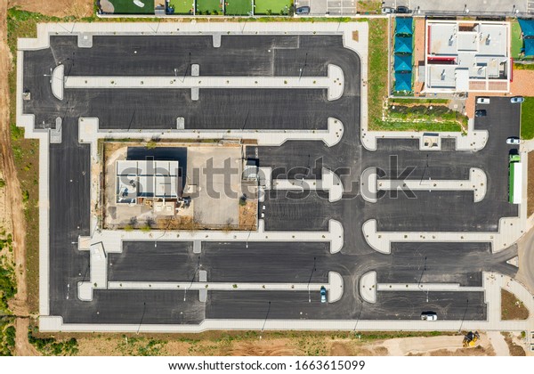 New Parking lot in final stages of construction,\
Top down aerial view.