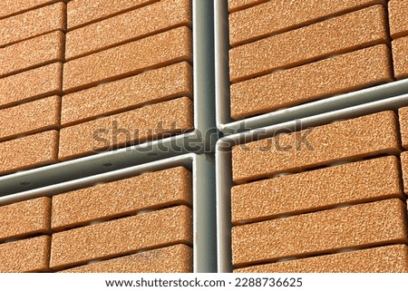 New performing modern exposed brick wall made with blocks with surface layer called ventilated wall system to improve thermal performance and properties