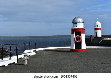 New Pier lighthouse in Castletown on the south of the Isle of Man. The seas are clear and people come here to see marine animals like basking sharks, harbour porpoises or seals