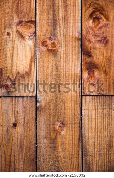 New pine boards on a\
fence