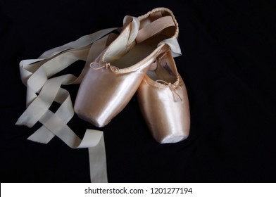 New Pink Ballet Pointe Shoes On Black Background