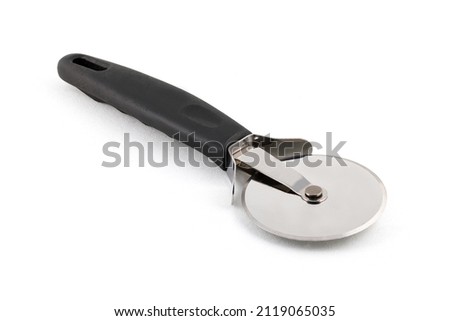 New pizza cutter with black handle isolated on white Close up. Full depth of field.