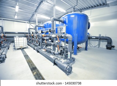 New Plastic Pipes And Colorful Equipment In Industrial Boiler Room