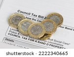 New pound coins on a council tax bill