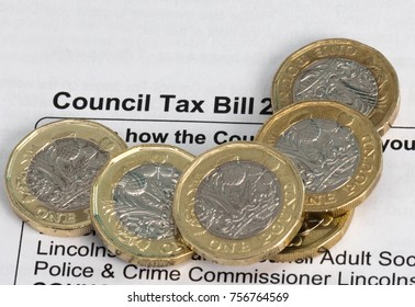 New Pound Coins On A Council Tax Bill