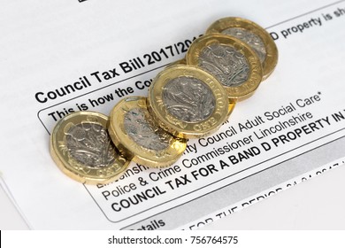 New Pound Coins On A Council Tax Bill