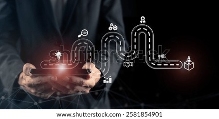 New product development and project roadmap concept. Business professional using tablet with digital virtual screen new product development roadmap icons, ideation, development and launching process. 