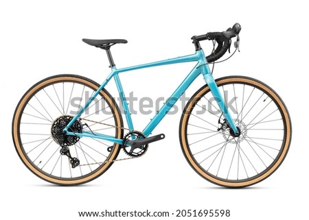 New professional gravel bike or road bike with blue frame isolated on white background. Active sport and recreation.